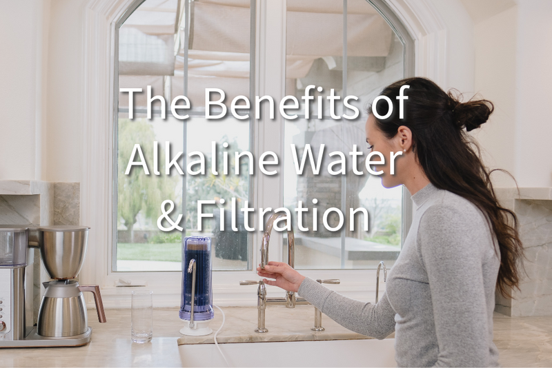 Women connecting a NU Aqua Alkaline filter to a faucet