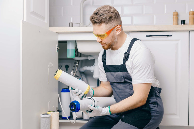 Plumber holding reverse osmosis and nanofiltration