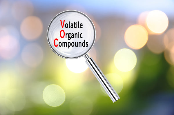 a magnifying glass with the words Volatile Organic Compounds in the middle