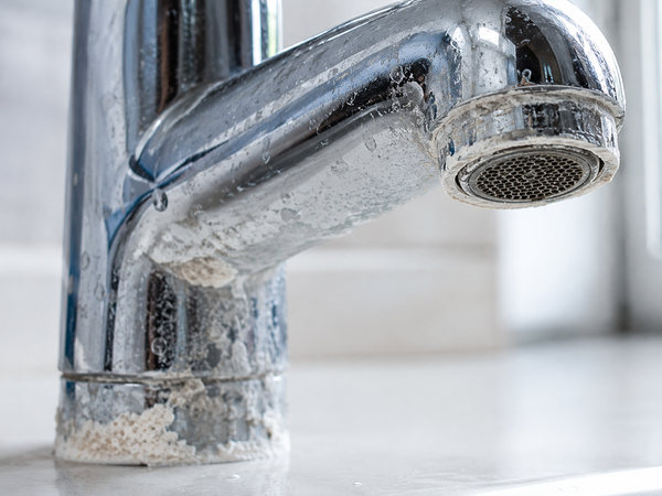 White scale on faucets and fixtures